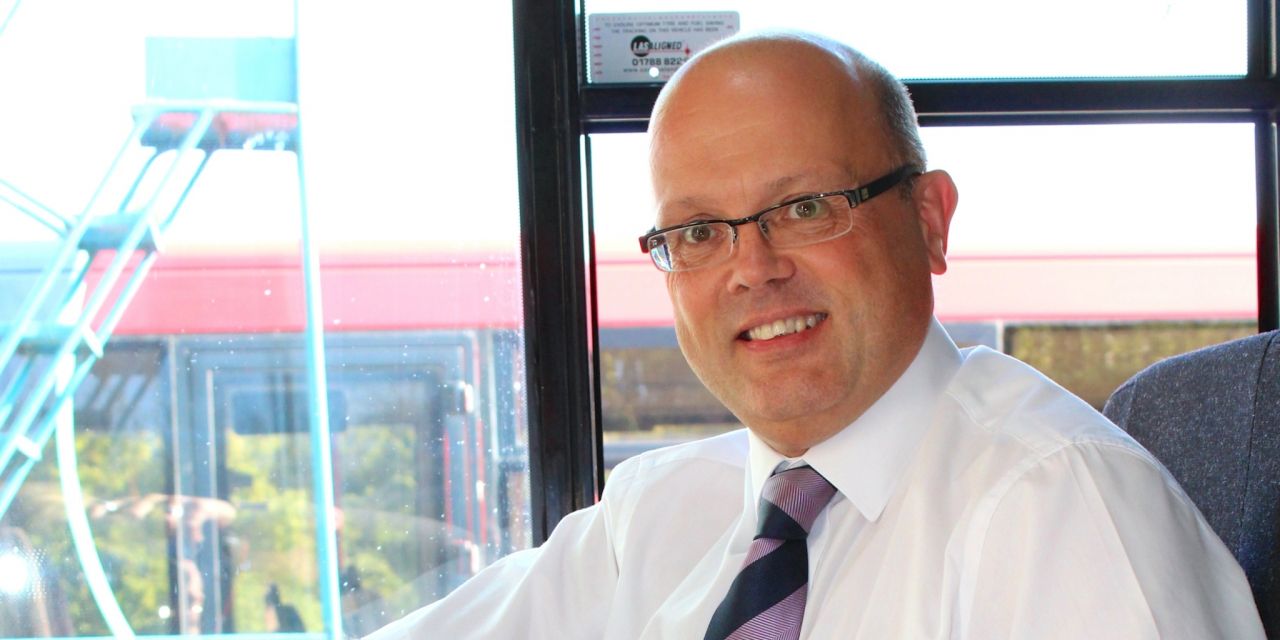 Managing director Andrew Wickham in the cab of a bus